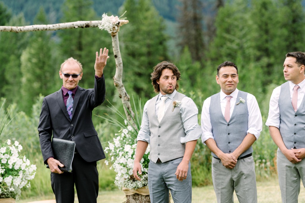 Grooms reaction when he sees the bride walking down the aisle at Heather Mountain Lodge Golden BC wedding photos