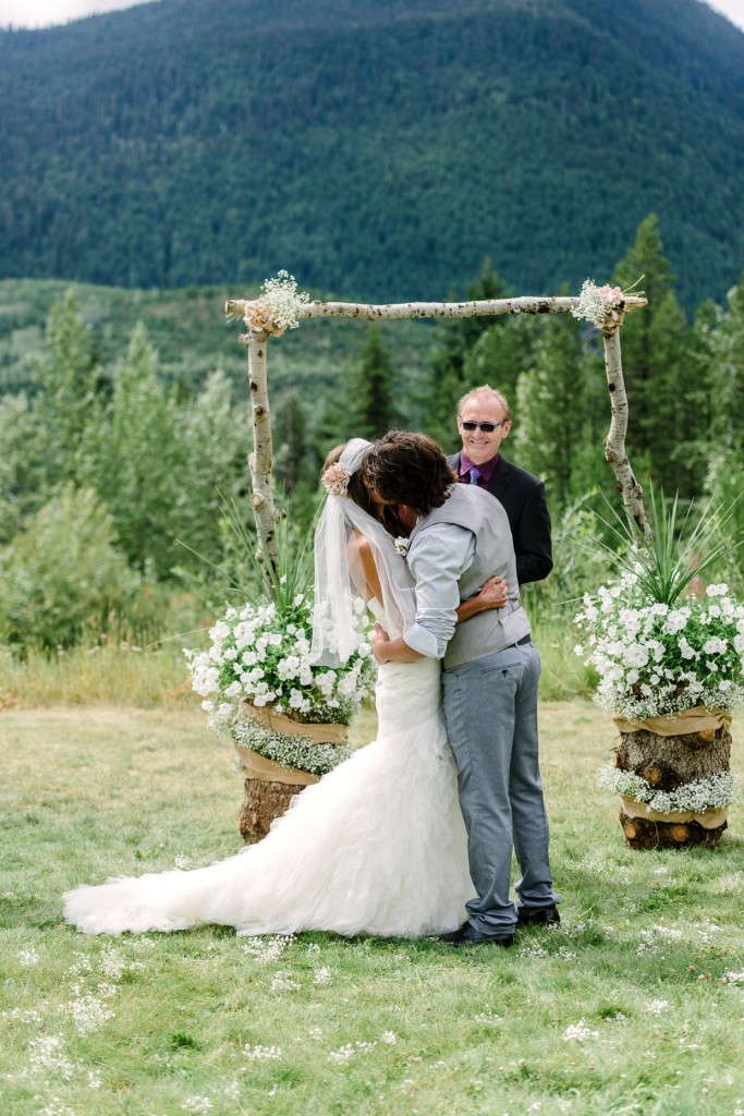 First kiss outdoor ceremony at Heather Mountain Lodge wedding Golden BC