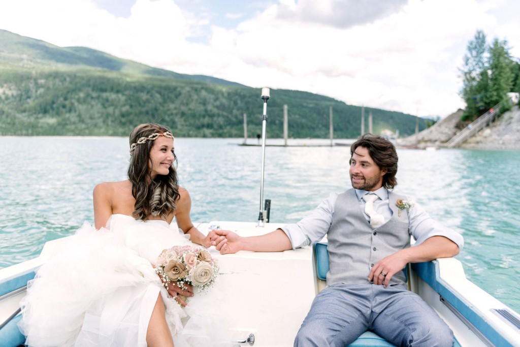 Romantic boat ride for the bride and groom at Kinbasket lake Golden BC wedding