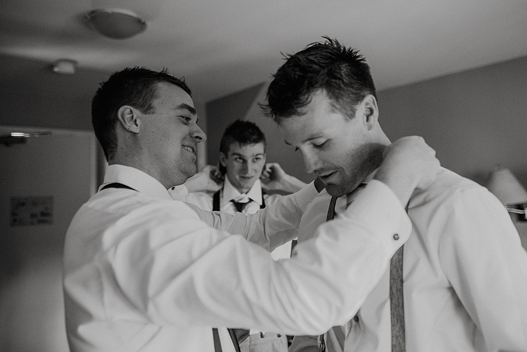 groomsmen-helping-groom-get-ready